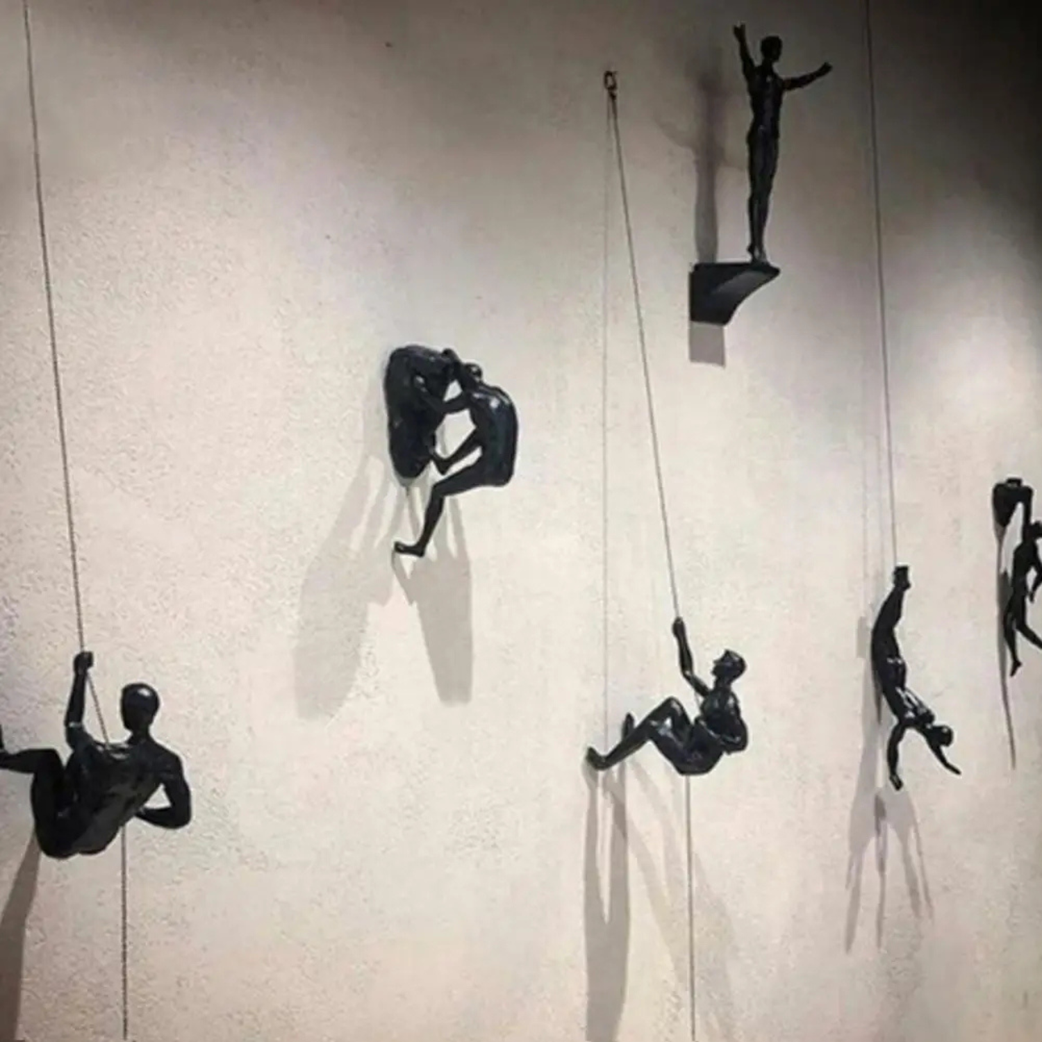 Harriet | Modern Climbing Man Wall Sculpture - Sculptures